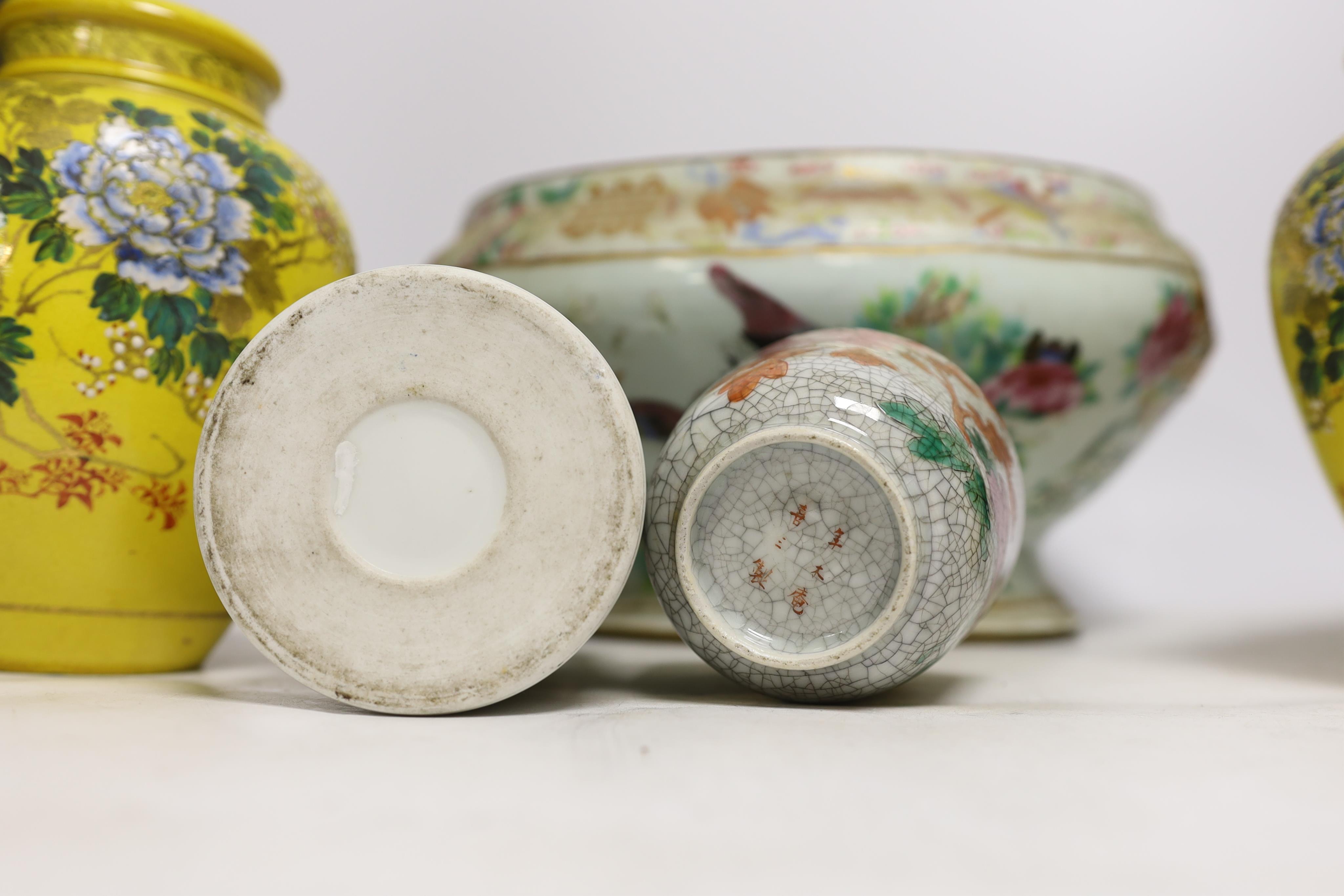 A 19th century Chinese famille rose tureen (lacking cover), a bronze mirror, a brush pot, a crackle glazed teabowl and a pair of Japanese yellow glazed satsuma jars and covers, tallest 18cm (6)